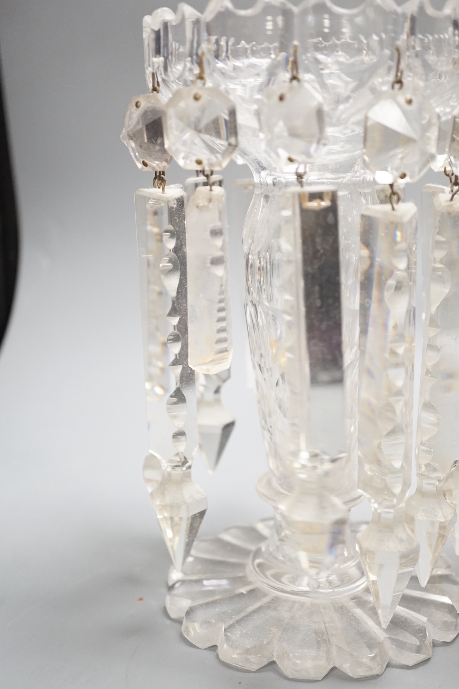 A pair of Victorian cut glass candle holders with 'spear' lustre drops (faults), 23cm high